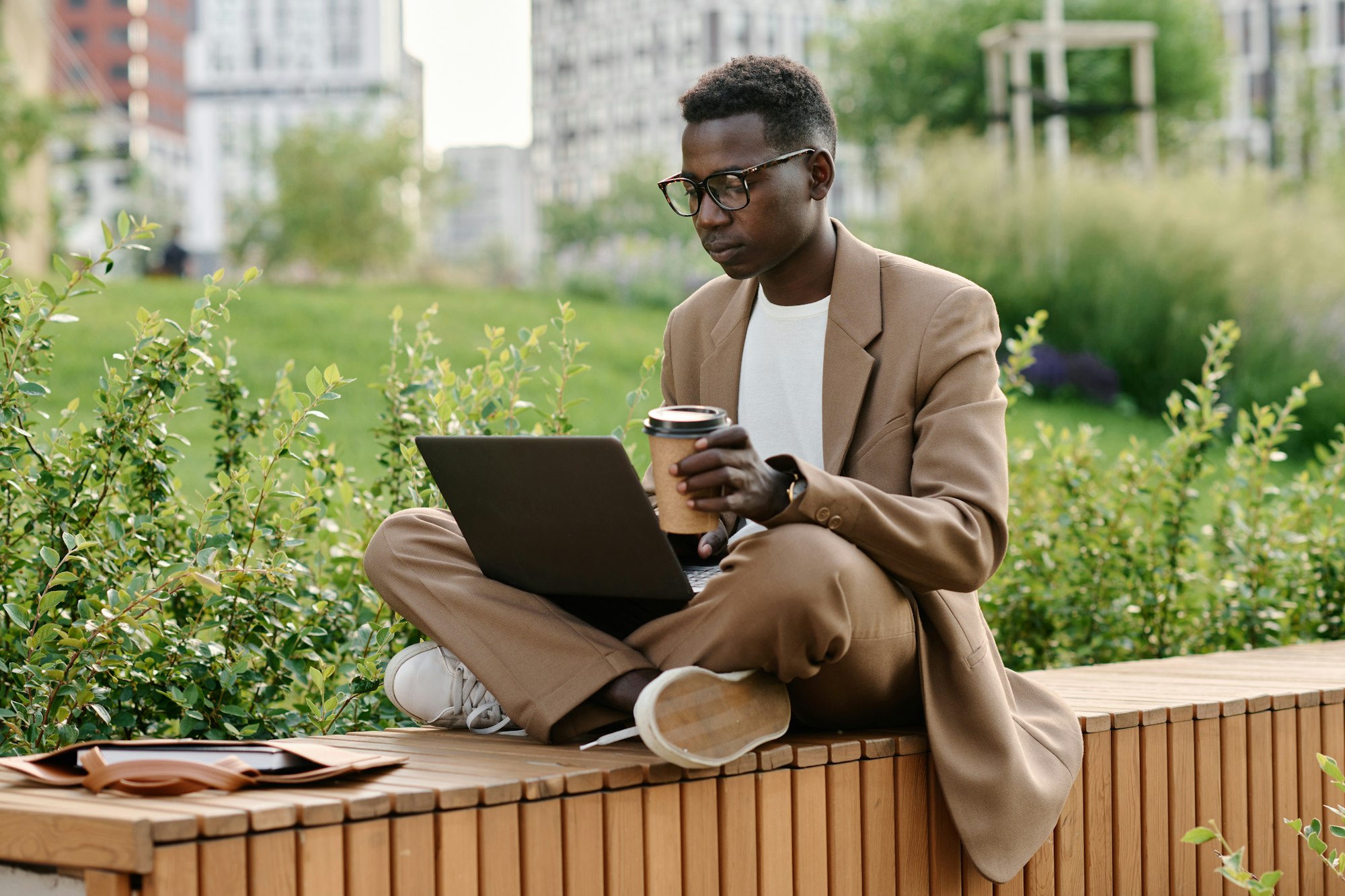 Gen Z Black Guy Working On Laptop During Coffee Break