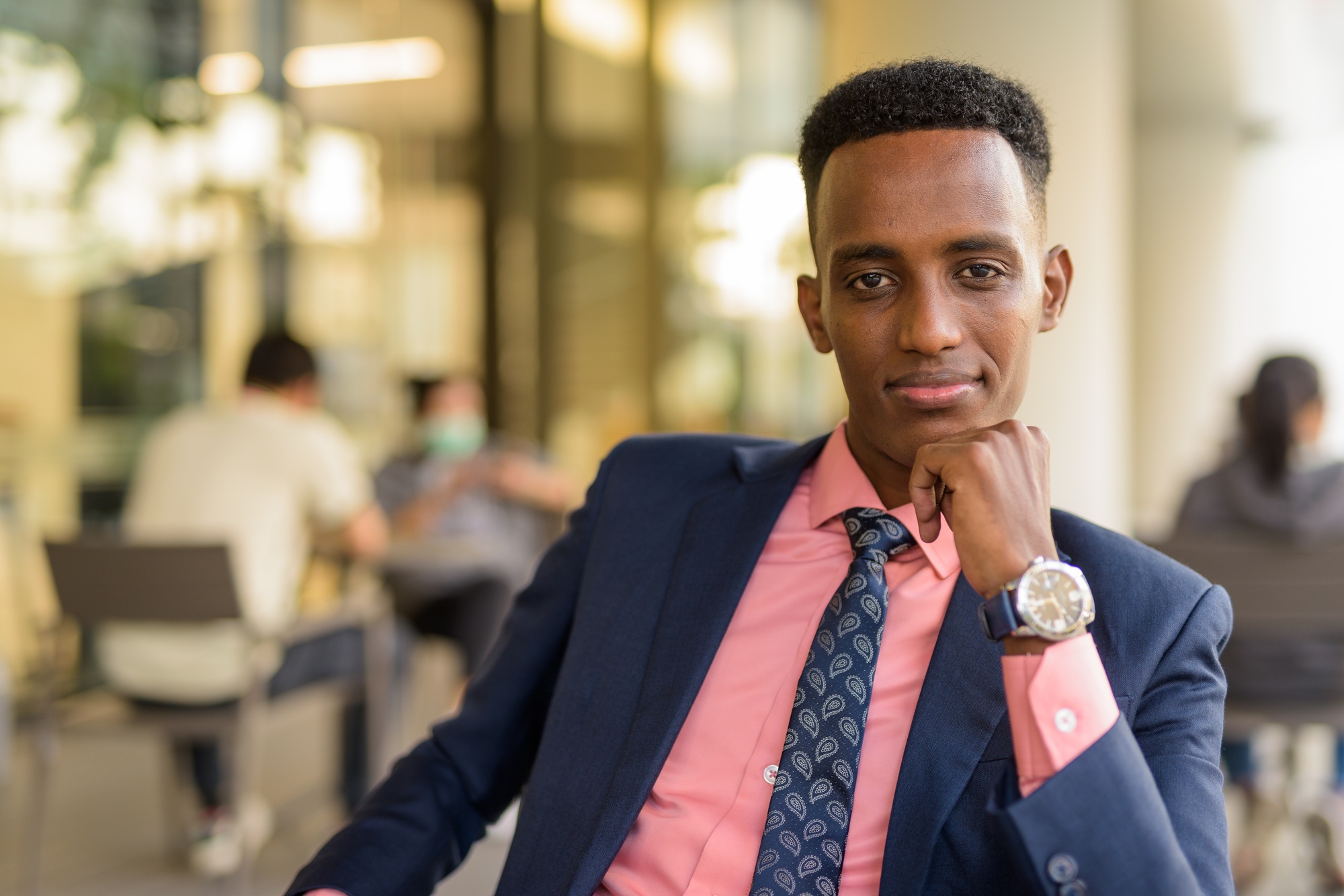 Portrait of successful young African businessman wearing suit and tie